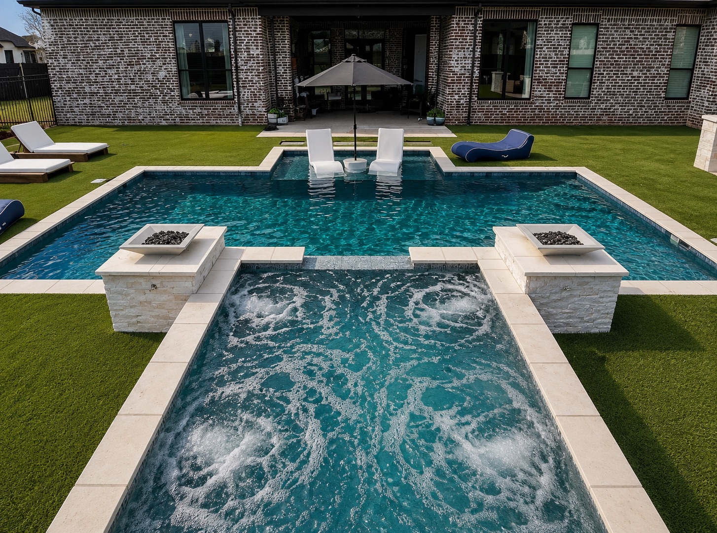 Custom geometric pool and raised spa built by Carrasco Pools behind a modern West Texas home